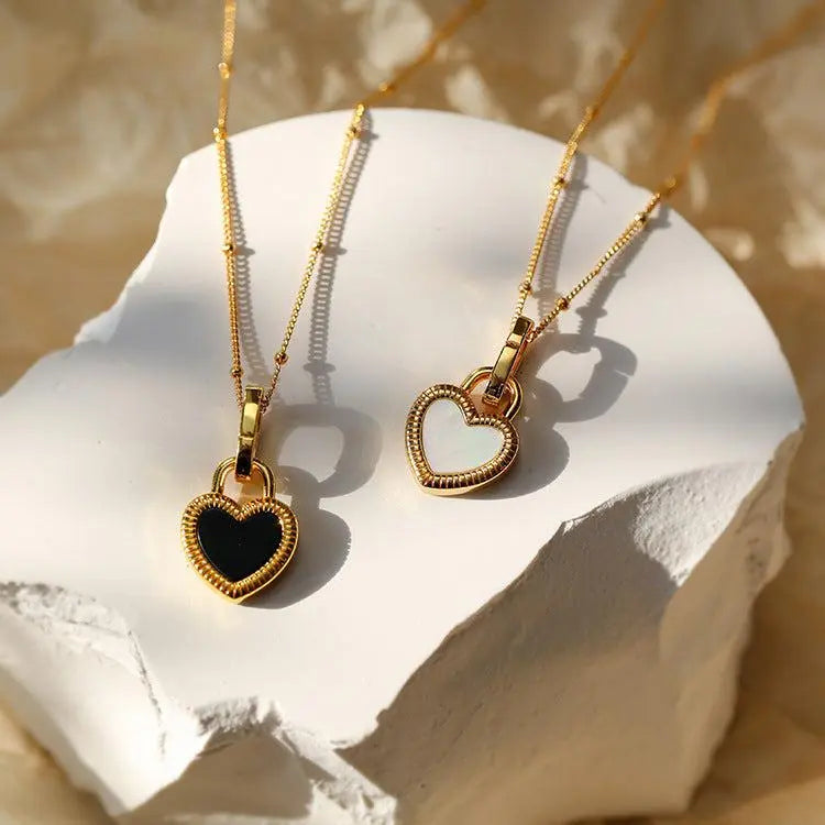 Black and white necklace with gold heart