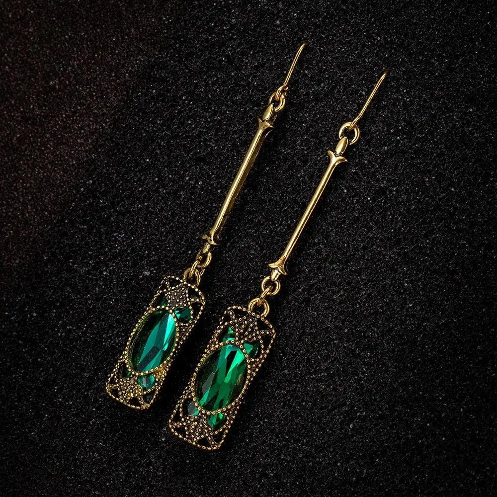 Gold pendant earrings with green lantern