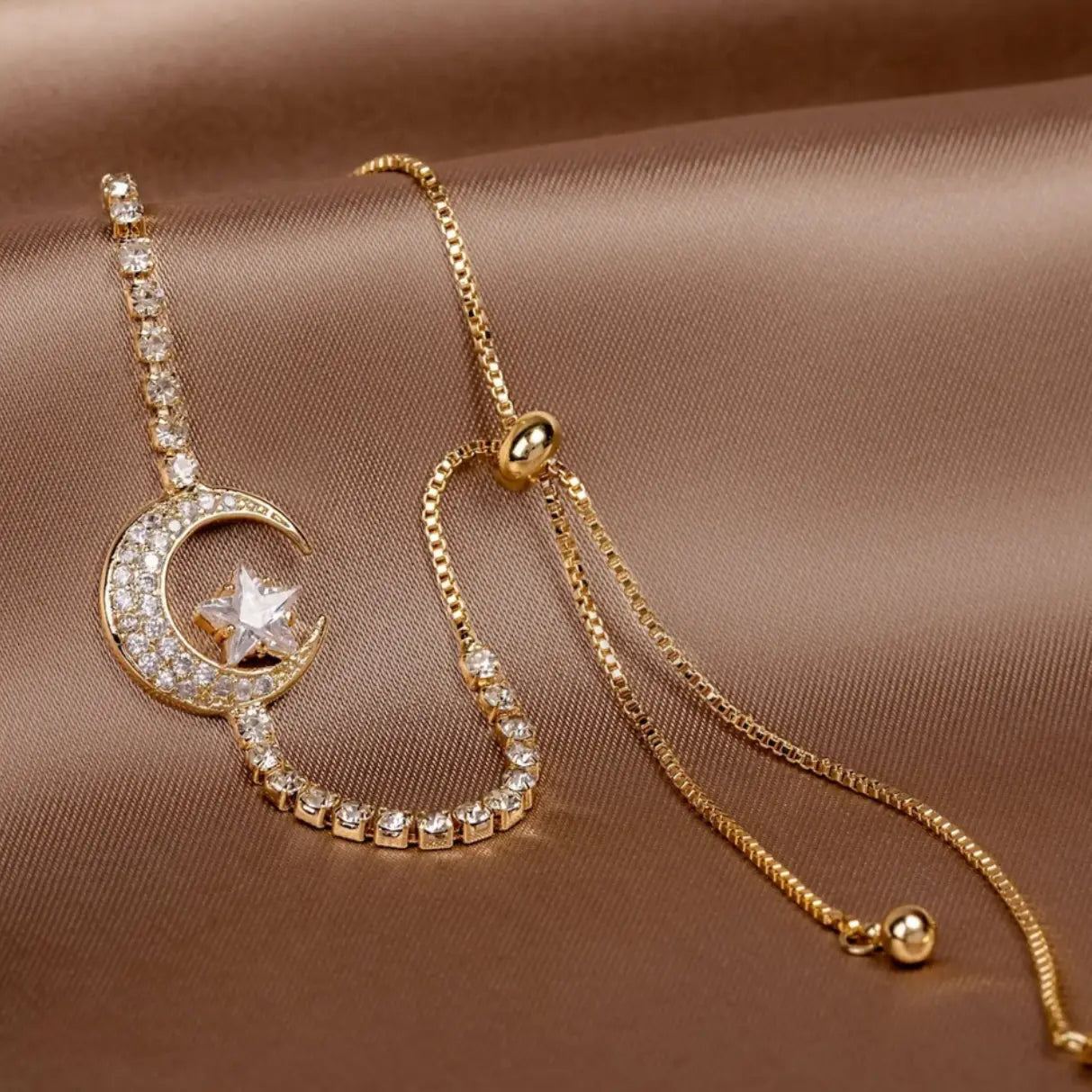 Moon-shaped pendant bracelets with zircons and gold