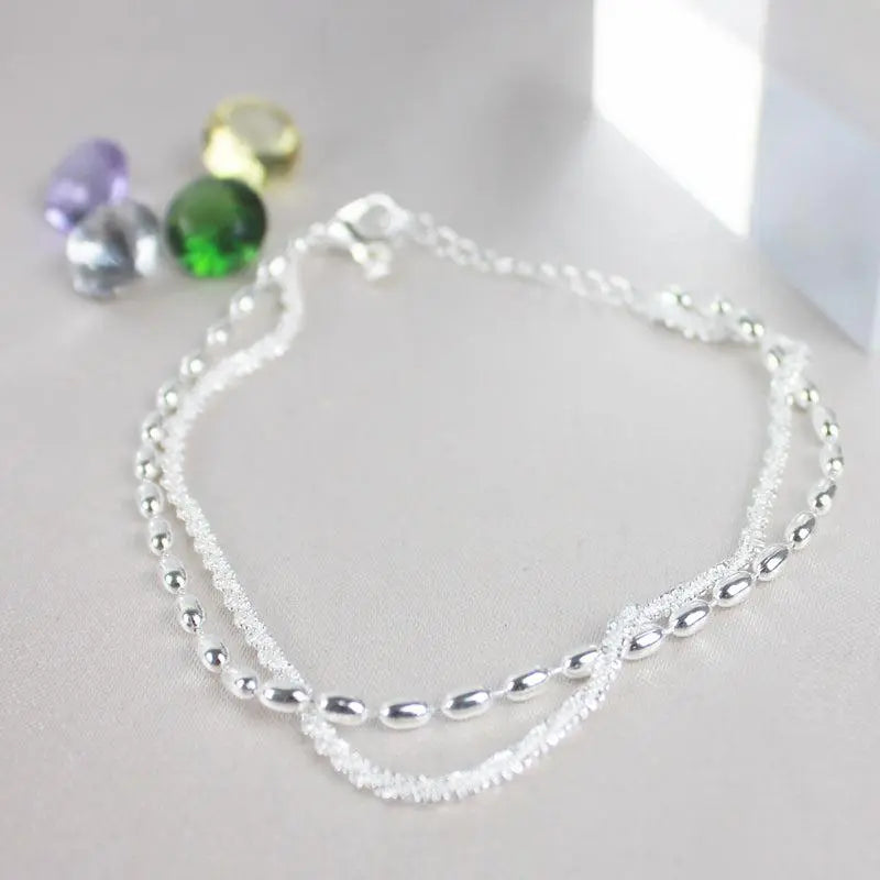 Silver bracelet with zircons