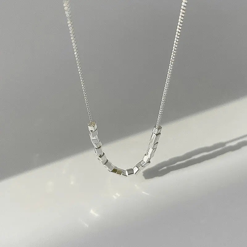 Modern pearl-inspired necklace with slender chain