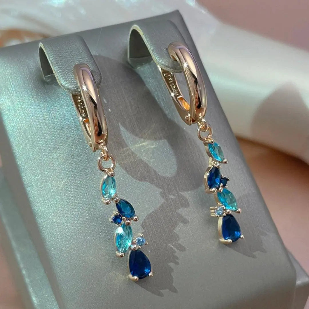 Elegant earrings with blue and gold crystals