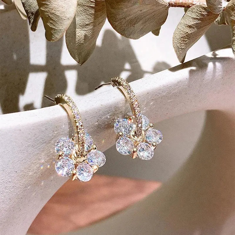 Gold earrings with crystal flowers