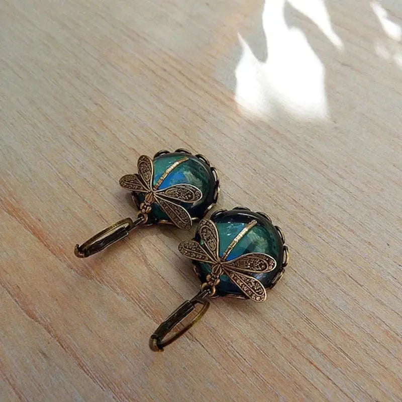 Spherical dragonfly earrings in antique gold color