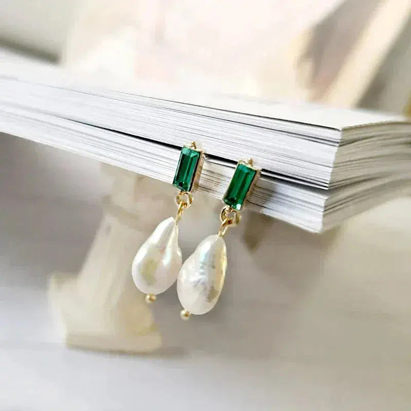 Luxury gold earrings with pearls and green zircons