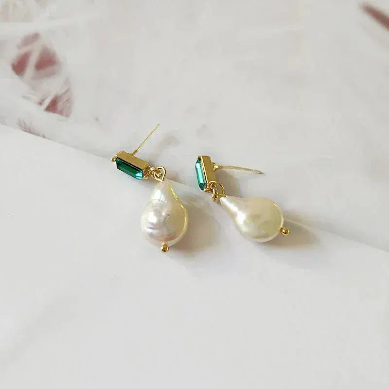 Luxury gold earrings with pearls and green zircons