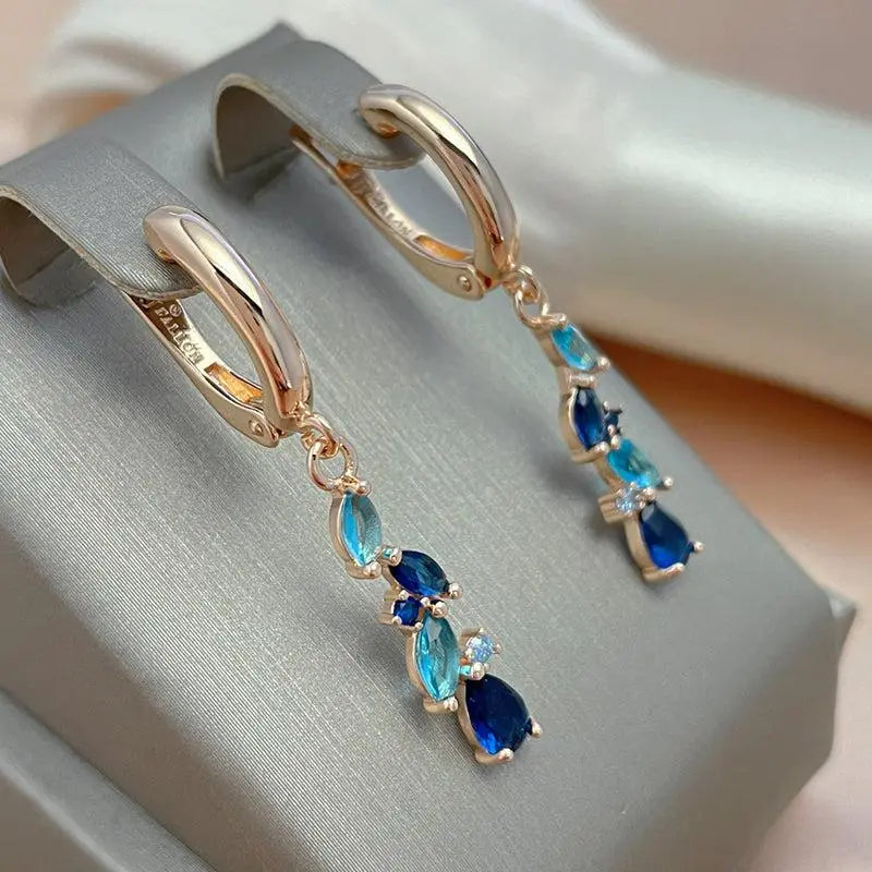 Elegant earrings with blue and gold crystals