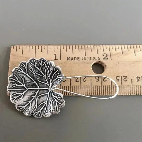 Silver earrings in the shape of leaves