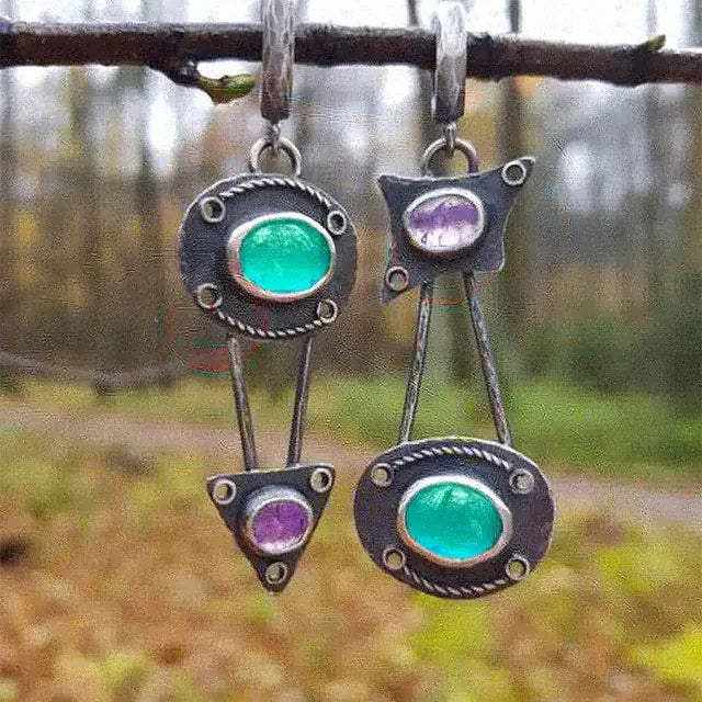 Mechanical earrings with crystals in vintage style