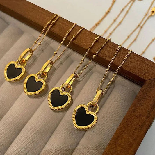 Black and white necklace with gold heart