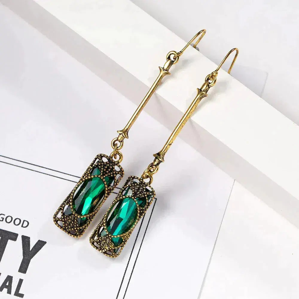 Gold pendant earrings with green lantern