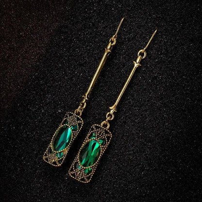 Gold pendant earrings with green lantern