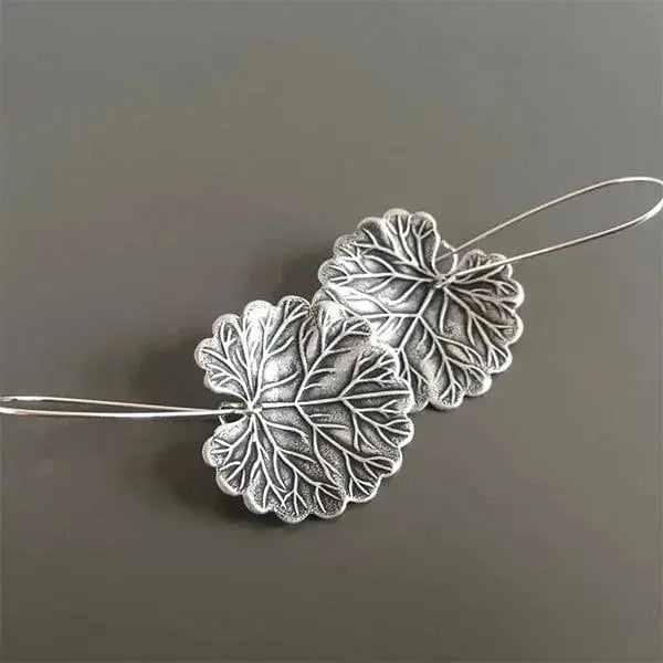 Silver earrings in the shape of leaves