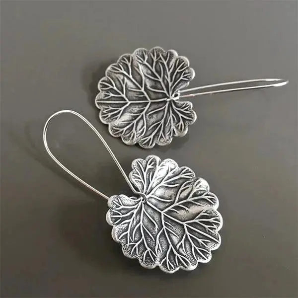 Silver earrings in the shape of leaves