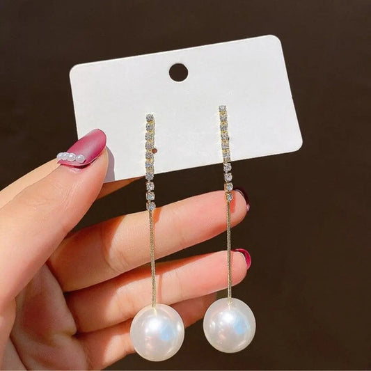 Pendant pearl earrings with zircons in gold