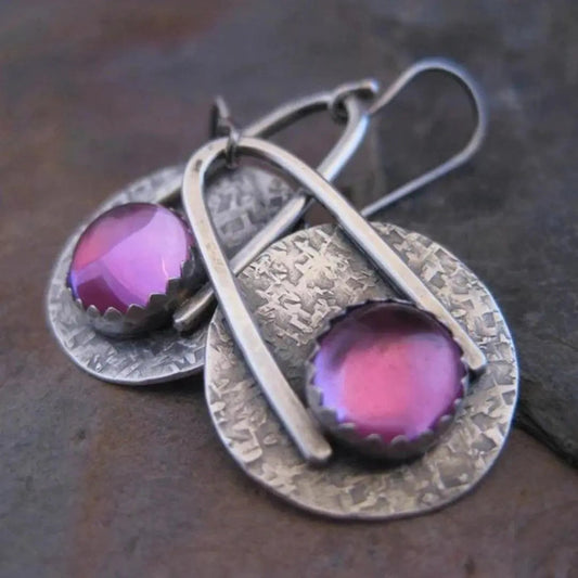 Boho earrings with purple stones in silver setting