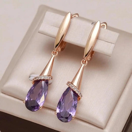 Gold earrings with purple zircons