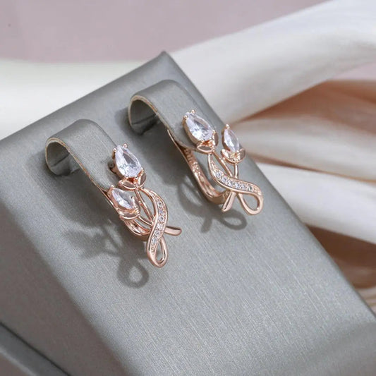 Elegant gold earrings with crystal roses and zircons
