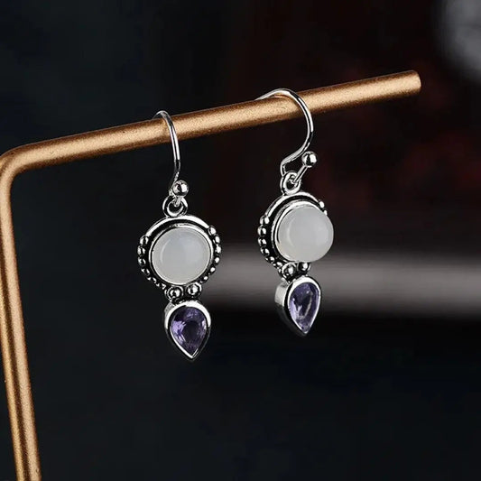 Moonstone earrings with purple crystals
