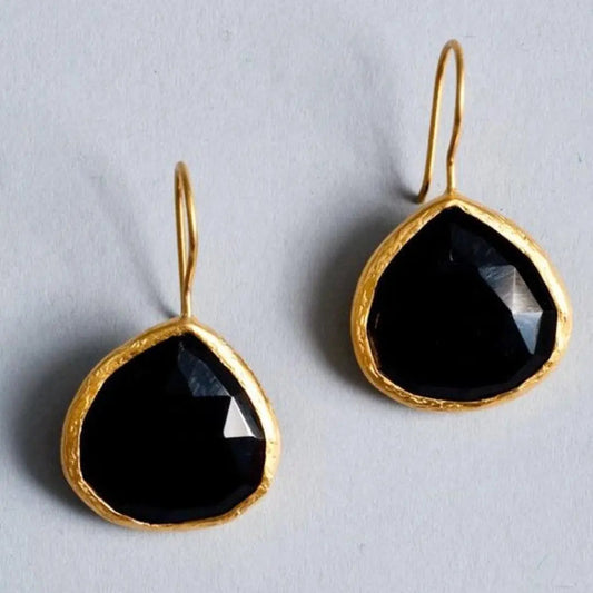 Gold vintage earrings with black stone