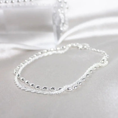 Silver bracelet with zircons