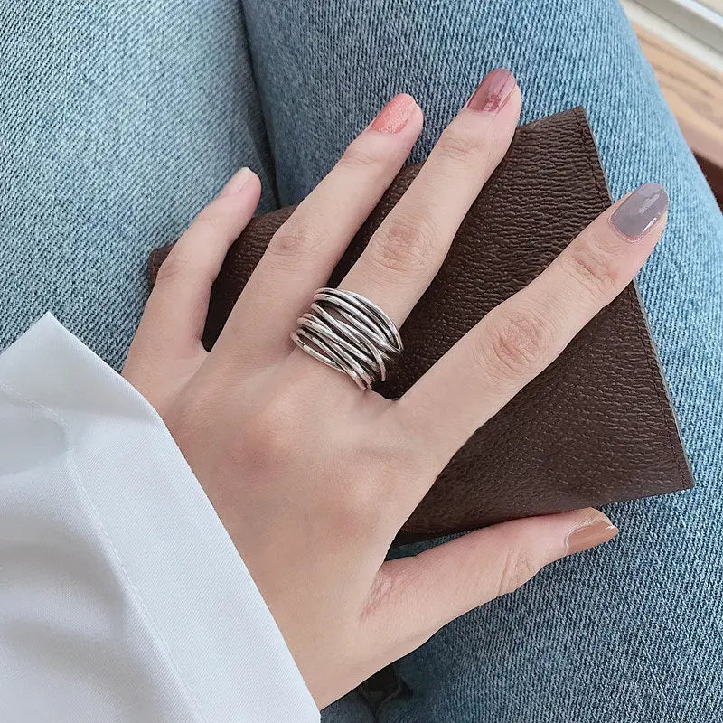 Adjustable, multi-layered ring in sterling silver