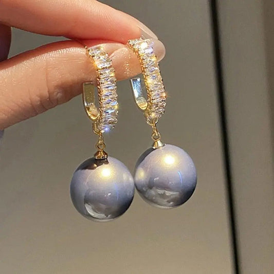 Luxury earrings with pearls and zircons