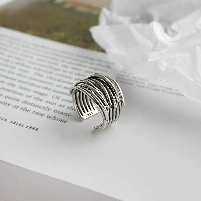 Adjustable, multi-layered ring in sterling silver