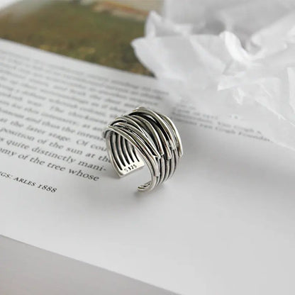 Adjustable, multi-layered ring in sterling silver