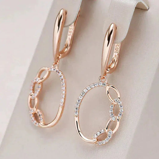 Elegant earrings with gold zircons