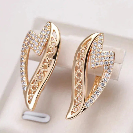 Elegant gold earrings with zircons