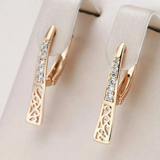 Small gold earrings with natural zircons
