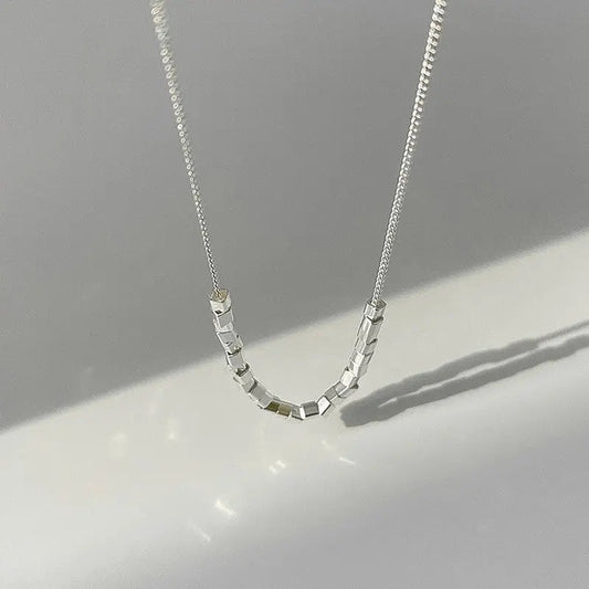Modern pearl-inspired necklace with slender chain
