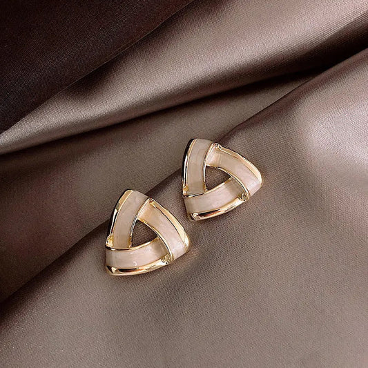 Modern geometric gold earrings with pearls