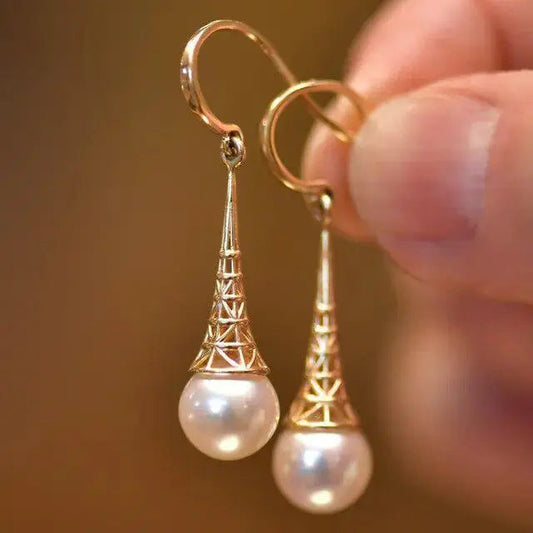 Gold pendant earrings with elegant pearls