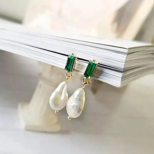 Luxury gold earrings with pearls and green zircons