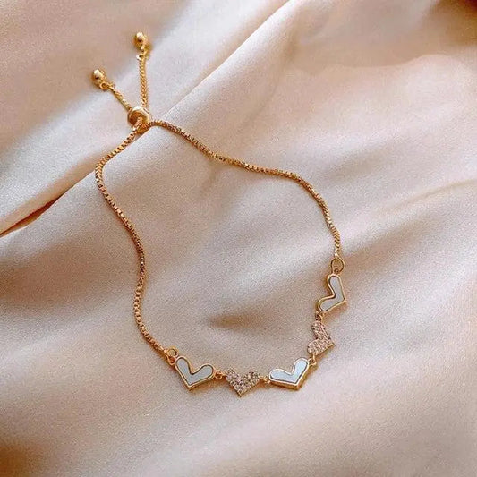 Adjustable gold bracelet with heart