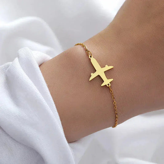 Gold bracelet in the shape of an airplane