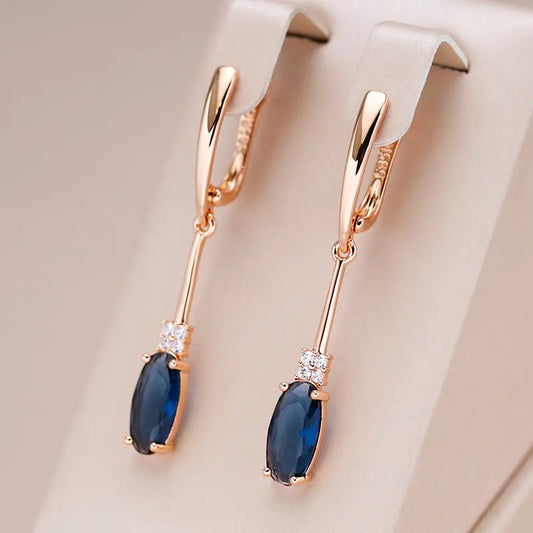 Elegant gold earrings with blue crystals