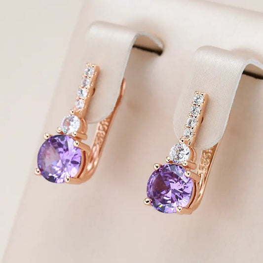 Purple earrings with rounded crystals