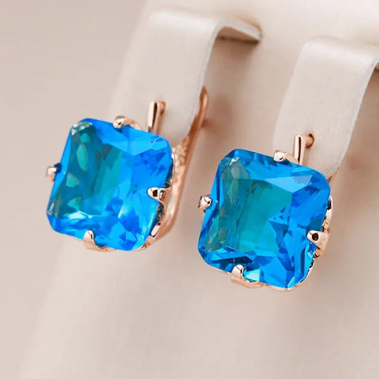 Gold earrings with zircons