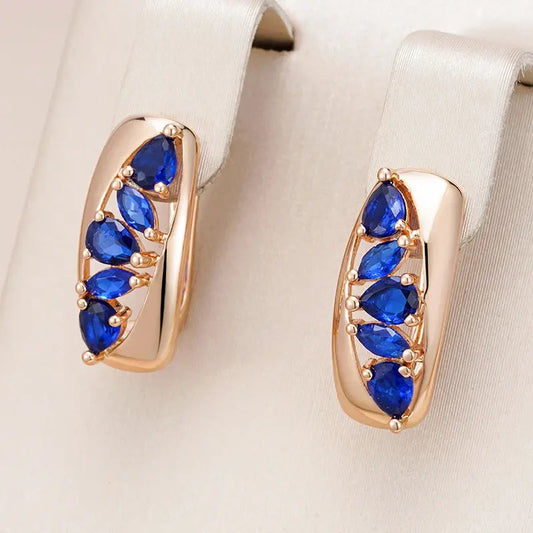 Earrings with blue crystals and gold enamel