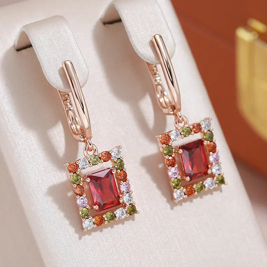 Elegant gold earrings with red cubic crystal