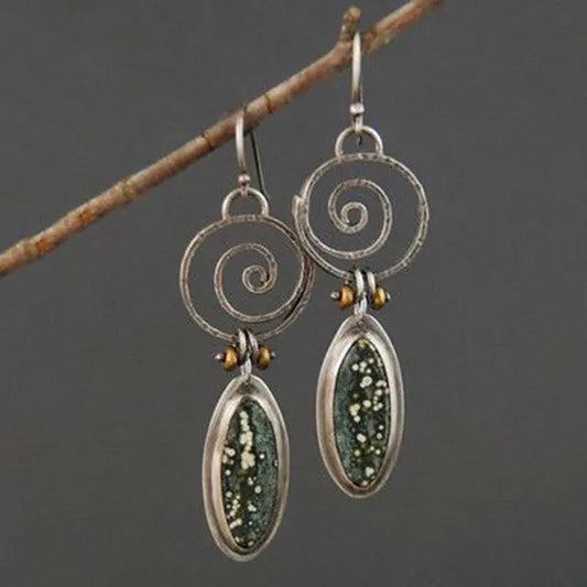 Silver earrings with light green stone