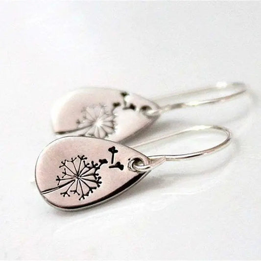 Silver earrings with dandelion