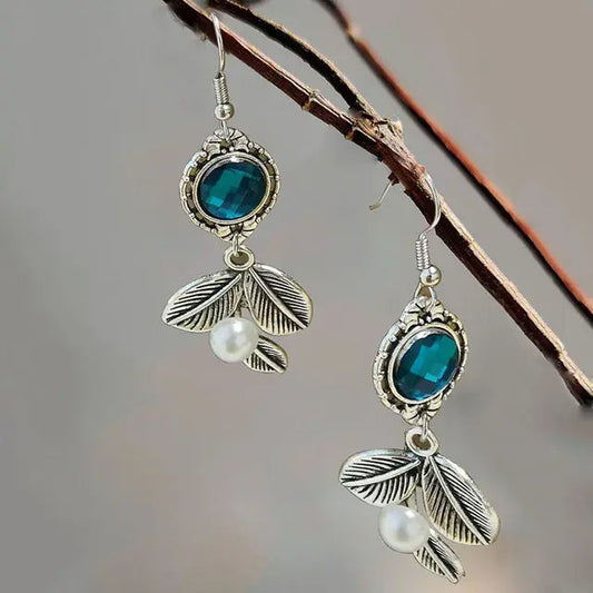 Pearl earrings with blue crystal leaves