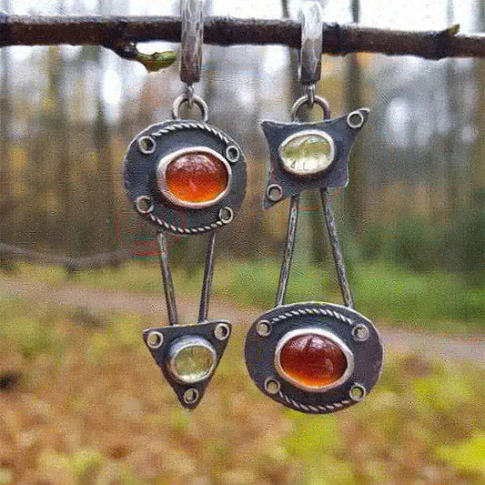 Mechanical earrings with crystals in vintage style