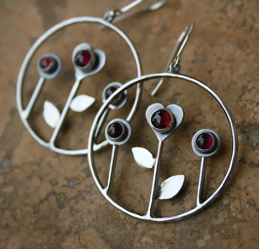 Heart-shaped earrings with red flower