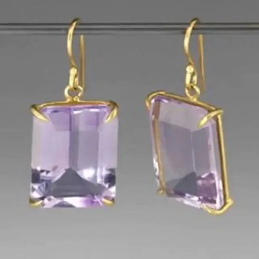 Gold earrings with purple crystals in vintage style