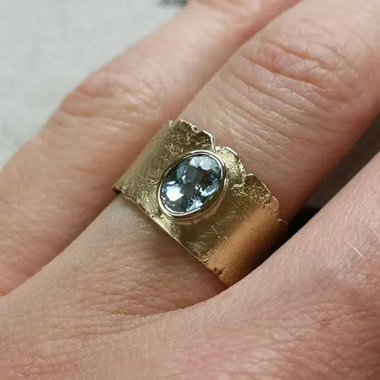 Vintage style gold ring with blue crystal